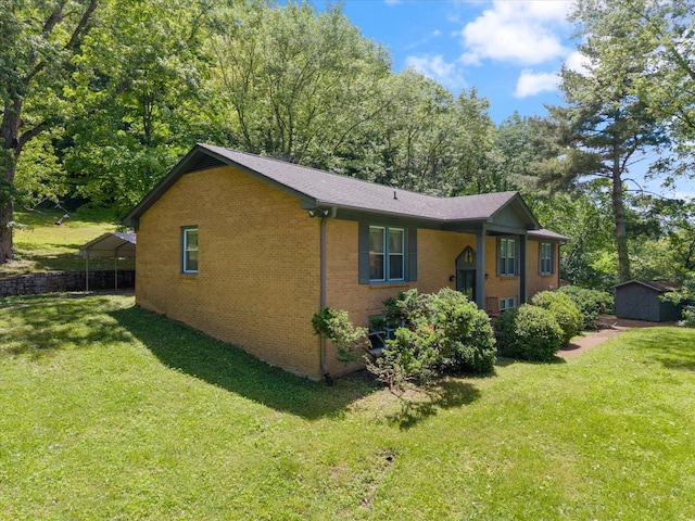 1326 Holly Tree Gap Rd, Brentwood, TN 37027 - view of front facade with a storage unit, a front yard, an outbuilding, and brick siding