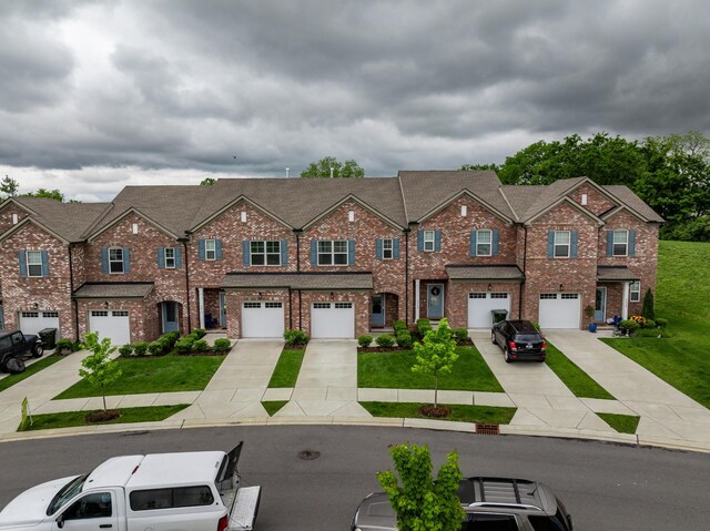 3021 Duvall Dr, Gallatin, TN 37066 - multi unit property with a garage, driveway, and brick siding