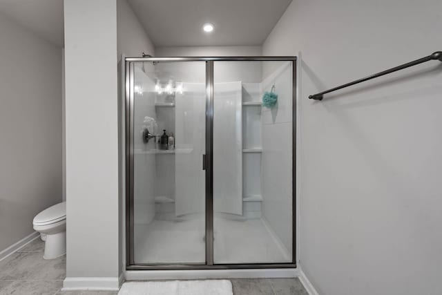 3021 Duvall Dr, Gallatin, TN 37066 - bathroom with a stall shower, baseboards, and toilet