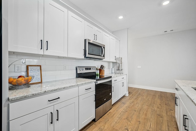 2617 Leawood Ct, Murfreesboro, TN 37128 - kitchen featuring appliances with stainless steel finishes, baseboards, tasteful backsplash, white cabinetry, and recessed lighting