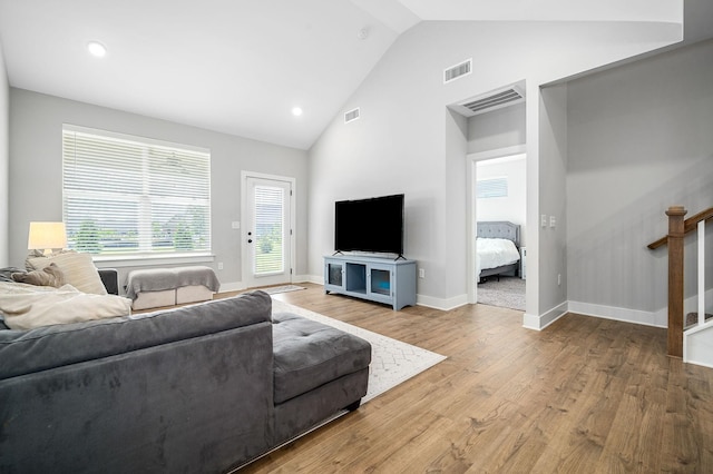 2617 Leawood Ct, Murfreesboro, TN 37128 - living area with wood finished floors, high vaulted ceiling, baseboards, recessed lighting, and stairs