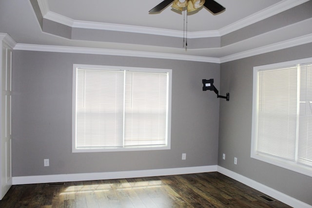 430 Gobble St, Lawrenceburg, TN 38464 - empty room with a tray ceiling, a ceiling fan, dark wood-style flooring, and crown molding