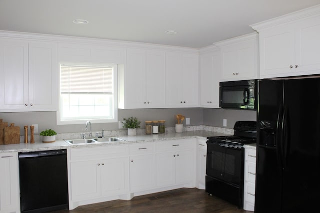 430 Gobble St, Lawrenceburg, TN 38464 - kitchen with black appliances, white cabinetry, and dark wood finished floors
