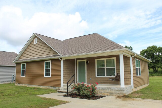 430 Gobble St, Lawrenceburg, TN 38464 - view of front facade featuring covered porch, a front yard, roof with shingles, and crawl space