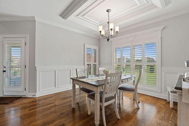 503 Carriage Ln, Lebanon, TN 37087 - dining room featuring a chandelier, wood finished floors, crown molding, a decorative wall, and wainscoting