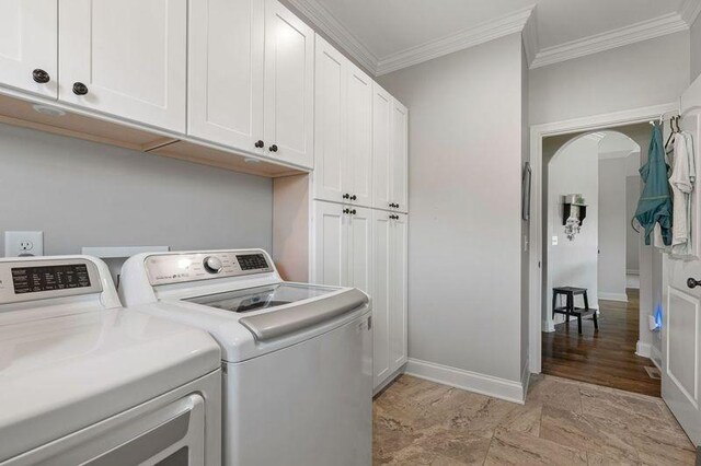 503 Carriage Ln, Lebanon, TN 37087 - laundry area with washer and clothes dryer, cabinet space, crown molding, and baseboards