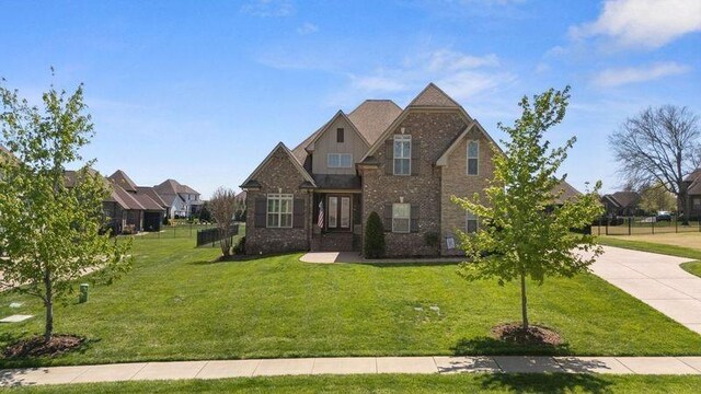 503 Carriage Ln, Lebanon, TN 37087 - craftsman-style house featuring a front yard, brick siding, and driveway