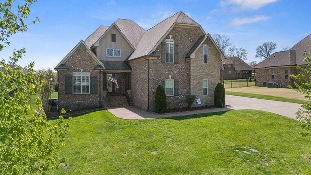 503 Carriage Ln, Lebanon, TN 37087 - craftsman inspired home with a front yard, driveway, and brick siding