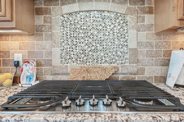 503 Carriage Ln, Lebanon, TN 37087 - kitchen view of stainless steel gas stovetop, tasteful backsplash, and light brown cabinets