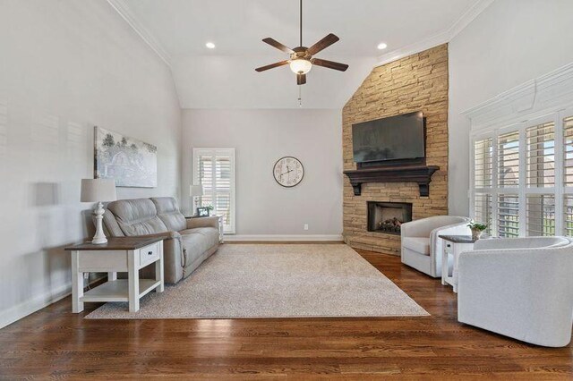 503 Carriage Ln, Lebanon, TN 37087 - living area featuring ceiling fan, a stone fireplace, crown molding, wood finished floors, and baseboards