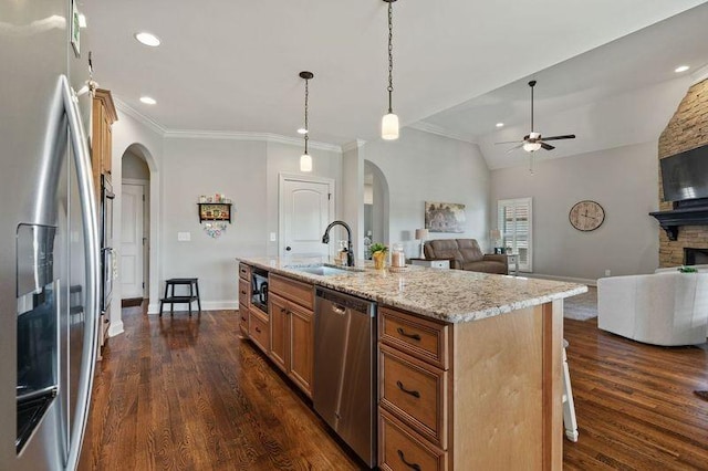 503 Carriage Ln, Lebanon, TN 37087 - kitchen with stainless steel appliances, arched walkways, open floor plan, ceiling fan, and a sink