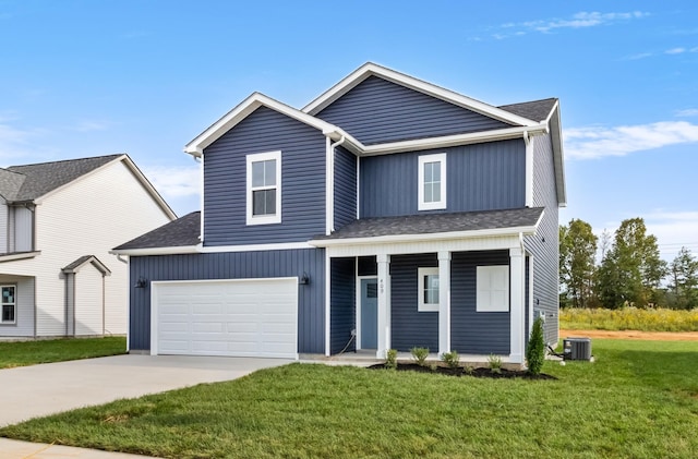 373 Galway Dr, Clarksville, TN 37042 - traditional-style house featuring covered porch, central air condition unit, concrete driveway, a front lawn, and a shingled roof