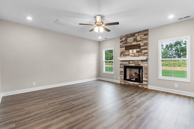 373 Galway Dr, Clarksville, TN 37042 - unfurnished living room featuring ceiling fan, dark wood-style floors, a stone fireplace, baseboards, and recessed lighting