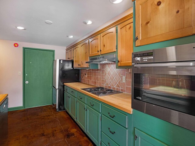 4200 W End Ave Unit 203, Nashville, TN 37205 - kitchen featuring butcher block counters, appliances with stainless steel finishes, under cabinet range hood, backsplash, and recessed lighting