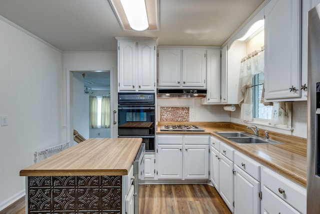 3008 Mcintire Dr, Columbia, TN 38401 - kitchen featuring oven, wood counters, a sink, stainless steel gas cooktop, and dark wood-style floors
