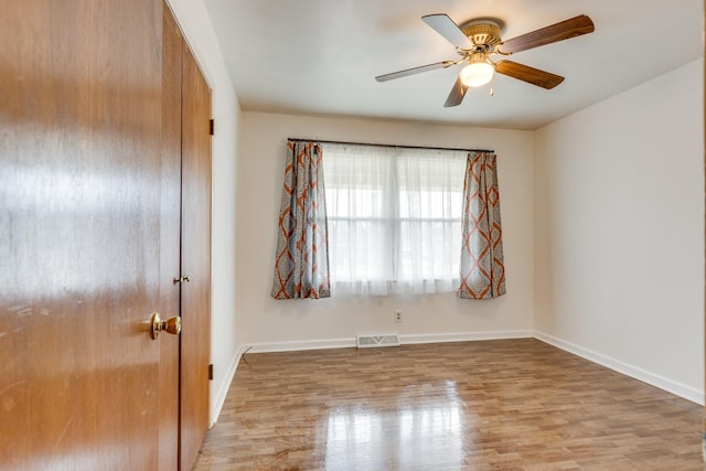 3008 Mcintire Dr, Columbia, TN 38401 - spare room with wood finished floors, ceiling fan, and baseboards