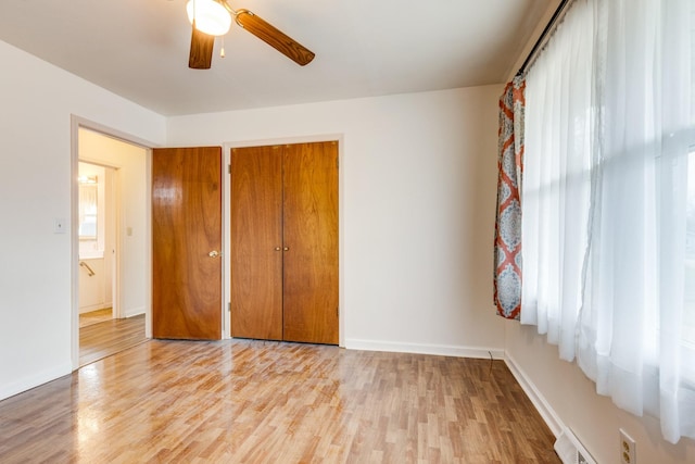 3008 Mcintire Dr, Columbia, TN 38401 - unfurnished bedroom with wood finished floors, a closet, baseboards, and a ceiling fan