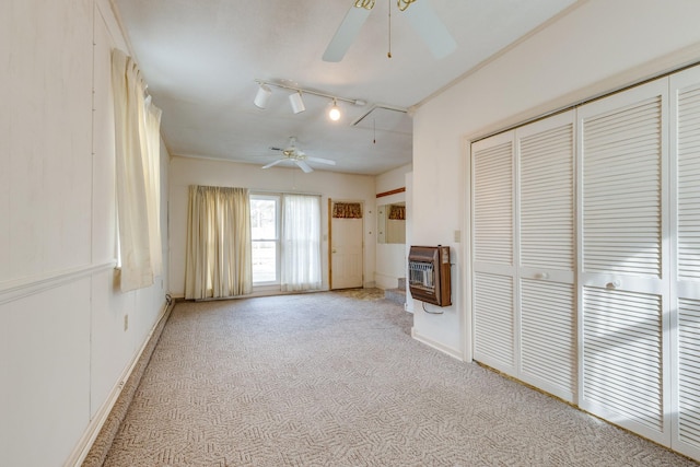 3008 Mcintire Dr, Columbia, TN 38401 - unfurnished living room featuring heating unit, ceiling fan, light carpet, baseboards, and rail lighting