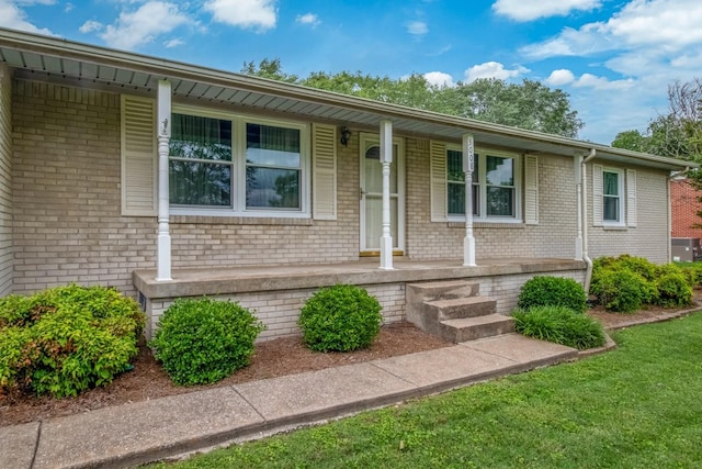3008 Mcintire Dr, Columbia, TN 38401 - view of front of home featuring a porch, brick siding, and a front lawn