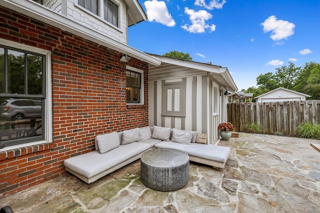 view of patio / terrace with fence and an outdoor hangout area