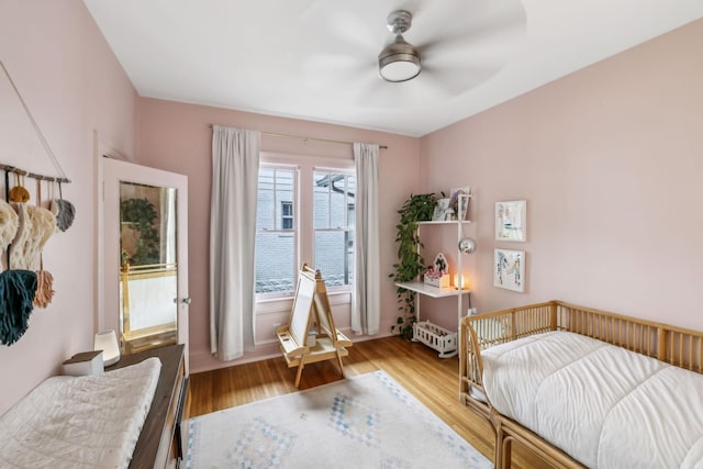 bedroom with wood finished floors and ceiling fan