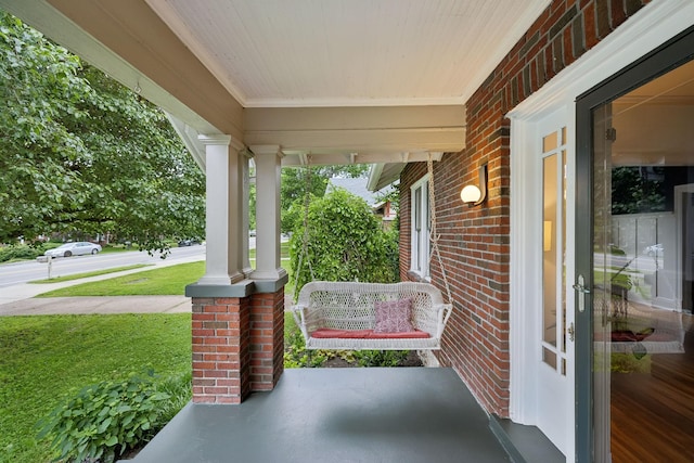 view of patio featuring a porch