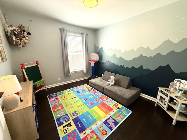 rec room with wood finished floors and baseboards