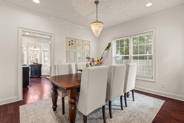 813 Swanson Blvd, Fayetteville, TN 37334 - dining area featuring a chandelier, baseboards, a textured ceiling, dark wood-style flooring, and crown molding