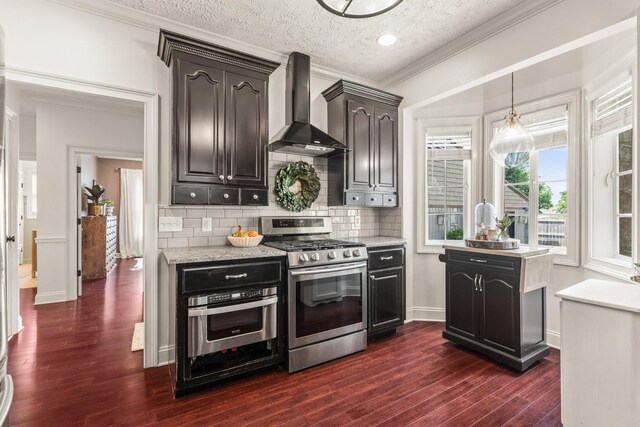 813 Swanson Blvd, Fayetteville, TN 37334 - kitchen with stainless steel appliances, wall chimney exhaust hood, dark wood-style flooring, tasteful backsplash, and a textured ceiling
