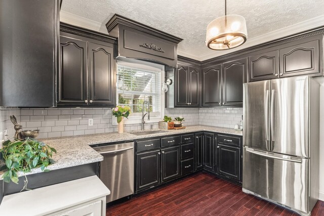 813 Swanson Blvd, Fayetteville, TN 37334 - kitchen featuring appliances with stainless steel finishes, a sink, ornamental molding, dark wood-style floors, and a textured ceiling