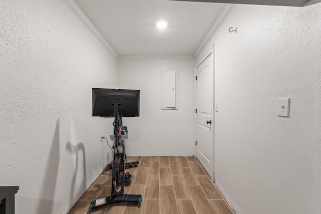 813 Swanson Blvd, Fayetteville, TN 37334 - exercise area featuring crown molding, wood finish floors, electric panel, and baseboards