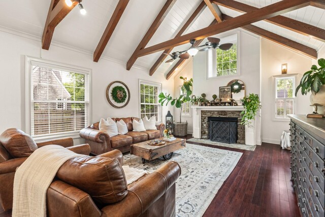 813 Swanson Blvd, Fayetteville, TN 37334 - living area featuring healthy amount of natural light, dark wood-type flooring, a ceiling fan, beam ceiling, and a stone fireplace