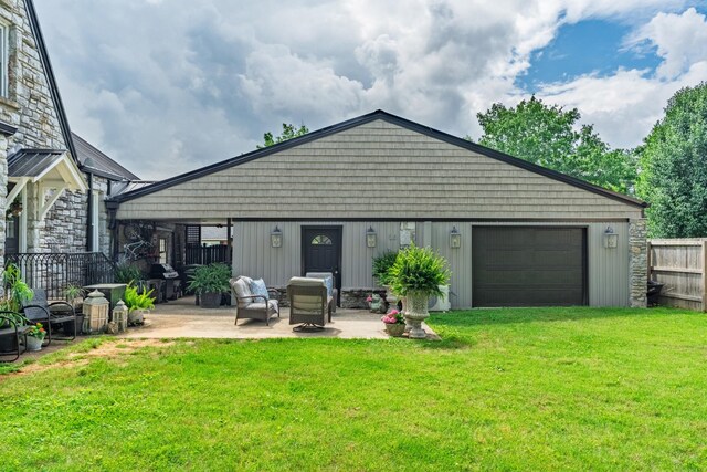 813 Swanson Blvd, Fayetteville, TN 37334 - back of house with a garage, a patio area, and stone siding