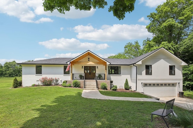 4151 Sadlersville Rd, Adams, TN 37010 - view of front facade with a garage, driveway, covered porch, and a front yard
