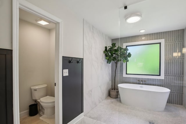 4151 Sadlersville Rd, Adams, TN 37010 - bathroom with toilet and a freestanding tub