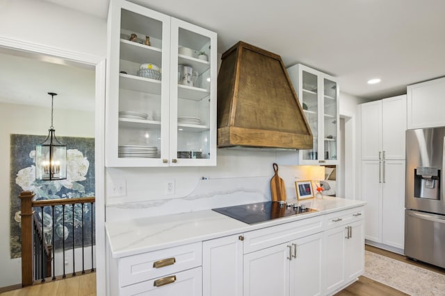 4151 Sadlersville Rd, Adams, TN 37010 - kitchen with stainless steel refrigerator with ice dispenser, black electric cooktop, custom exhaust hood, light wood-style flooring, and recessed lighting