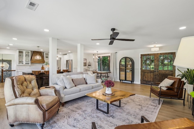4151 Sadlersville Rd, Adams, TN 37010 - living room featuring light wood-style flooring, ceiling fan, healthy amount of natural light, and recessed lighting