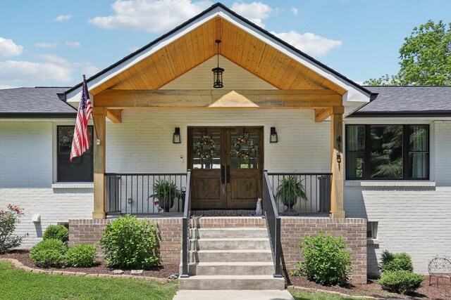 4151 Sadlersville Rd, Adams, TN 37010 - property entrance featuring brick siding and a porch