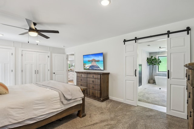 4151 Sadlersville Rd, Adams, TN 37010 - carpeted bedroom with a barn door, connected bathroom, baseboards, a ceiling fan, and recessed lighting