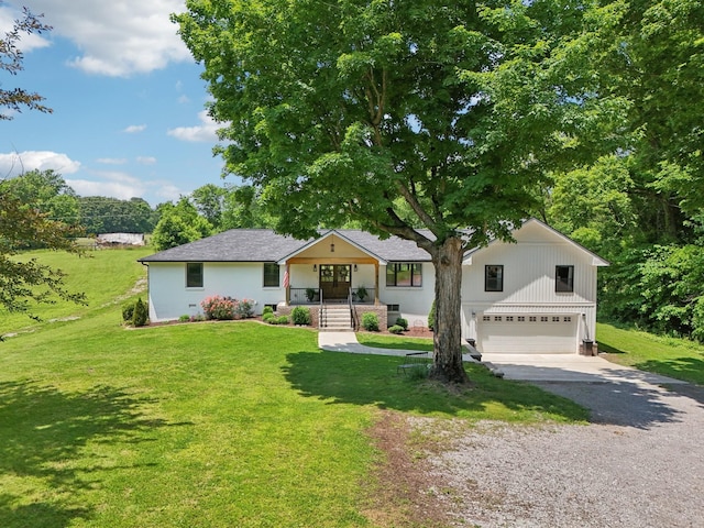4151 Sadlersville Rd, Adams, TN 37010 - view of front of property with gravel driveway, an attached garage, a porch, and a front yard