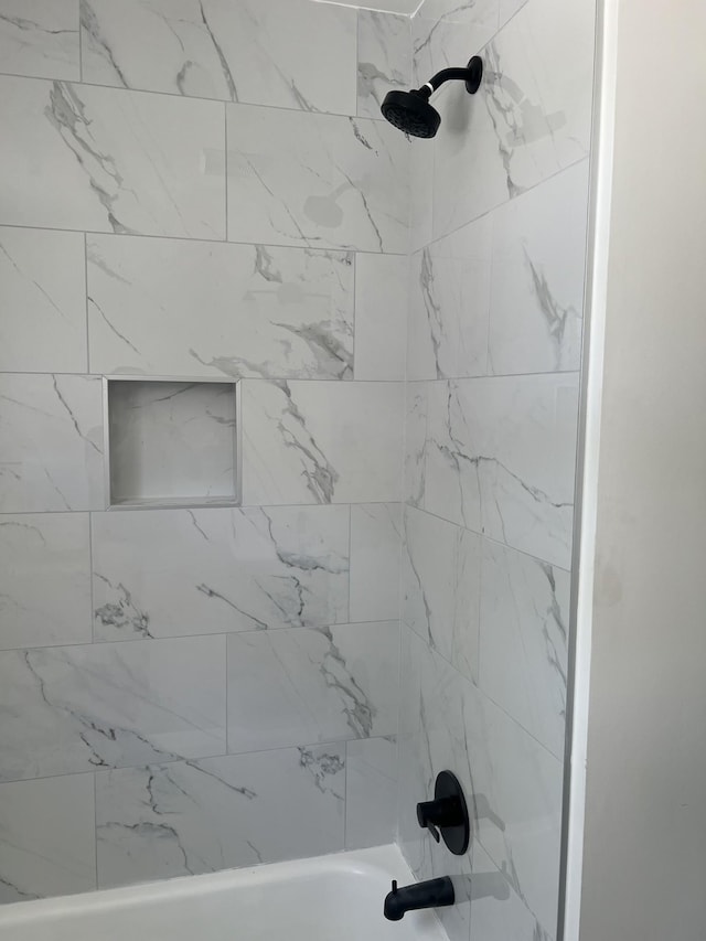 full bath featuring bathtub / shower combination