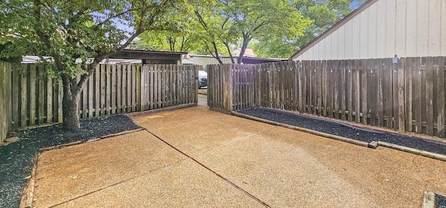 view of patio featuring fence