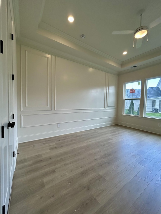 5742 Sagebrush Dr, Murfreesboro, TN 37129 - unfurnished room with a raised ceiling, ornamental molding, wood finished floors, a decorative wall, and a ceiling fan