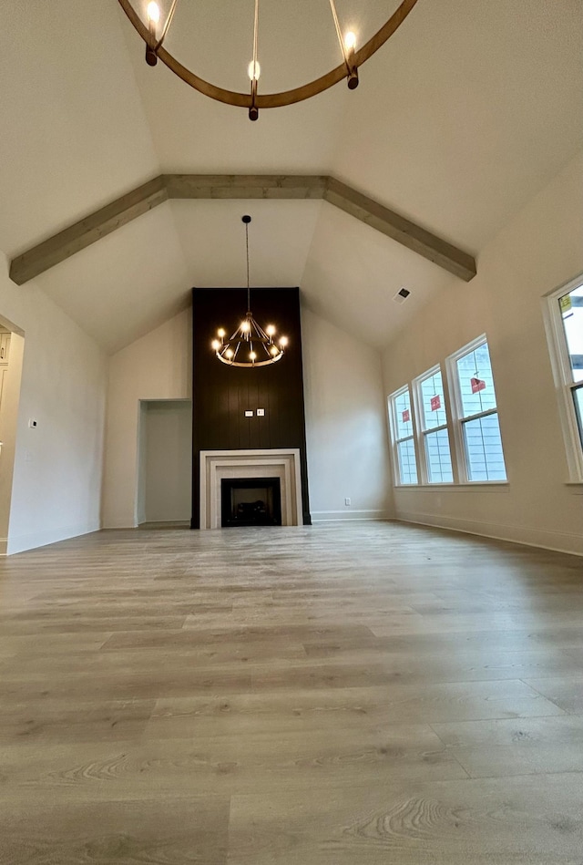 5742 Sagebrush Dr, Murfreesboro, TN 37129 - unfurnished living room featuring a chandelier, wood finished floors, beam ceiling, high vaulted ceiling, and a fireplace