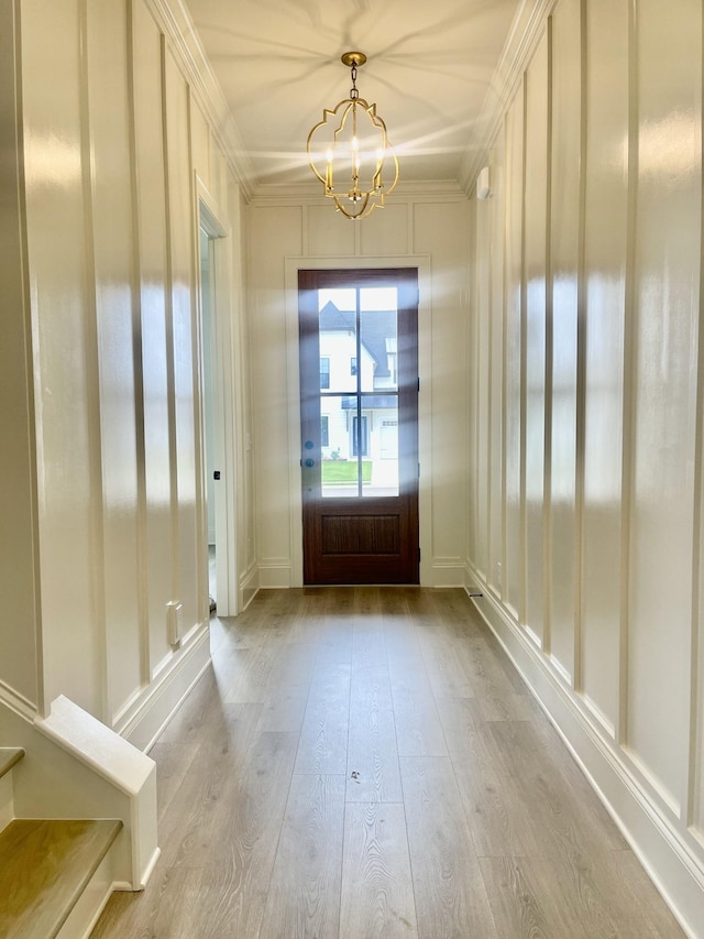 5742 Sagebrush Dr, Murfreesboro, TN 37129 - entryway with a chandelier, crown molding, wood finished floors, and stairs