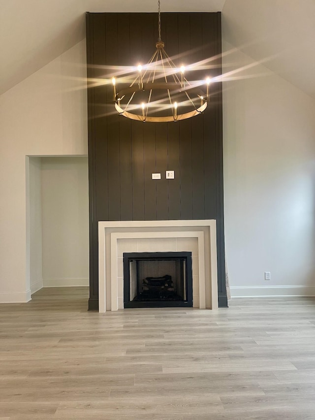 5742 Sagebrush Dr, Murfreesboro, TN 37129 - detailed view of a chandelier, wood finished floors, baseboards, and a tile fireplace