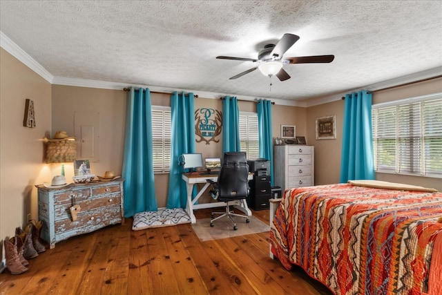 bedroom with hardwood / wood-style flooring, ornamental molding, a textured ceiling, an office area, and ceiling fan