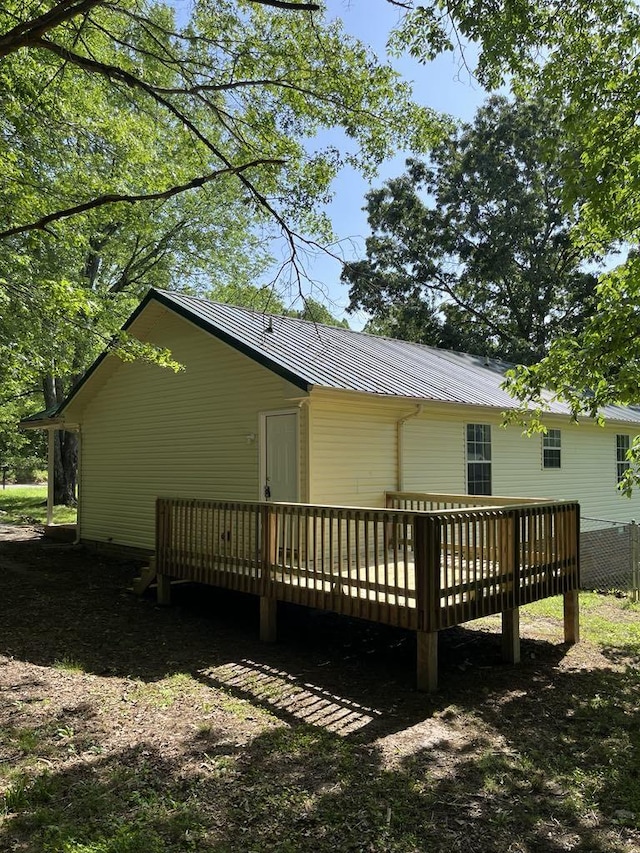 8315 Oak Springs Rd, Nunnelly, TN 37137 - rear view of property with a deck and metal roof