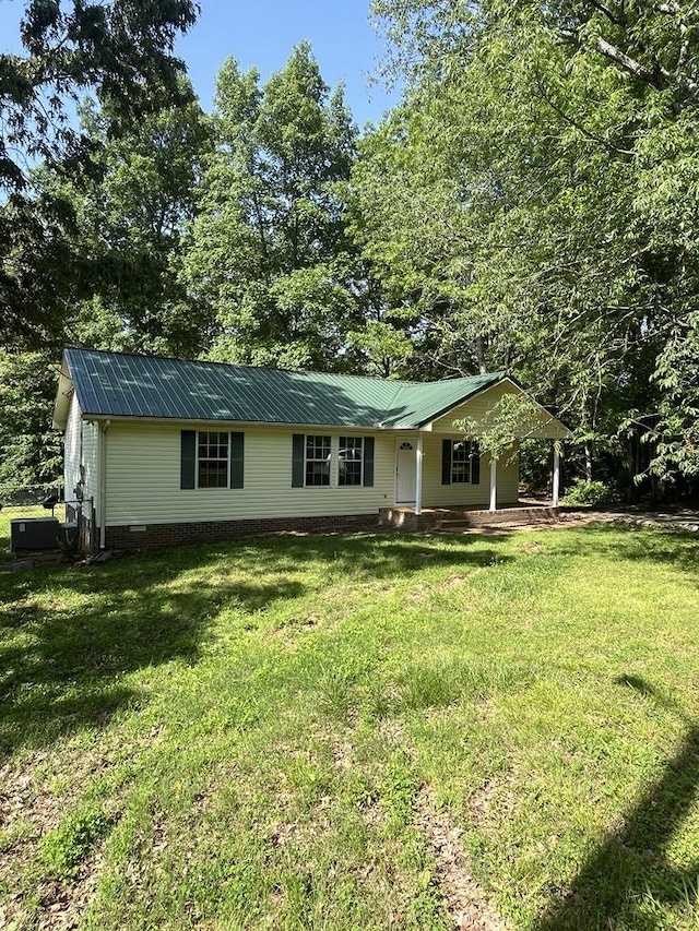 8315 Oak Springs Rd, Nunnelly, TN 37137 - single story home featuring a front lawn, metal roof, and covered porch