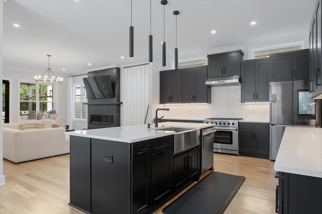 1541 Battlefield Dr Unit A, Nashville, TN 37215 - kitchen featuring appliances with stainless steel finishes, a sink, under cabinet range hood, light countertops, and recessed lighting